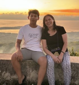 Teresita with her son in the Philippines.