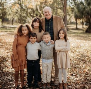 Andrea Bass and John with his grandchildren and niece.