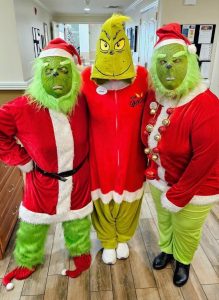 Andrea Bass (on left) as the Grinch.