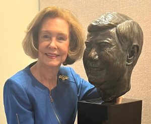 Adele Graham with bust of Senator Bob Graham at the Bob Graham Center for Public Service at UF.