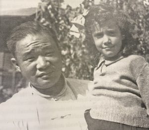 Victoria Bricker, age five, with their cook in Shanghai.