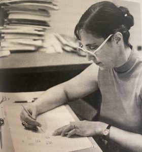 Victoria Bricker arranging glyphs on an illustration.