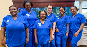 Health Pavilion Team Members at Oak Hammock showing off their new uniforms.