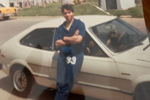 Dave Perez, age 17, with his first car, a 1981 Honda Accord.